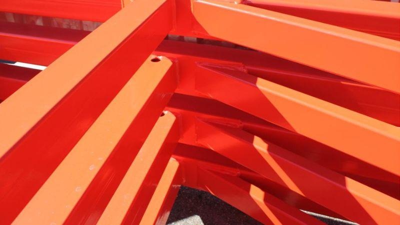 Orange powder coated steel beams 1